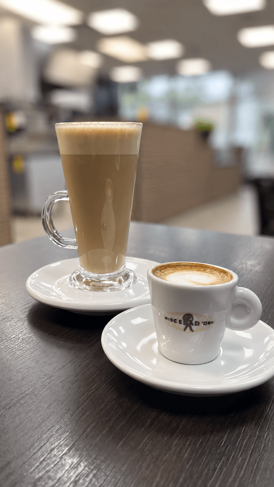 An espresso and a latte served together at A Pagnotta